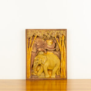 Intricate hand-carved wood wall relief of elephants in a forest by Sunflower Arts and Crafts for BISO.