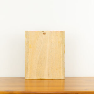 Intricate hand-carved wood wall relief of elephants in a forest by Sunflower Arts and Crafts for BISO.