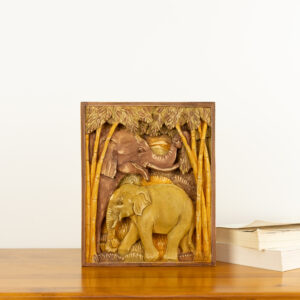 Intricate hand-carved wood wall relief of elephants in a forest by Sunflower Arts and Crafts for BISO.