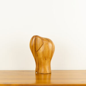 Modern minimalist hand-carved wooden elephant sculpture by traditional artists for BISO.