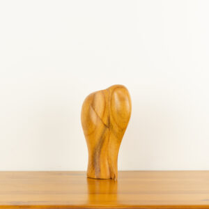 Modern minimalist hand-carved wooden elephant sculpture by traditional artists for BISO.