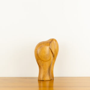 Modern minimalist hand-carved wooden elephant sculpture by traditional artists for BISO.