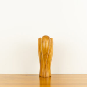 Modern minimalist hand-carved wooden elephant sculpture by traditional artists for BISO.
