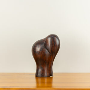 Modern minimalist elephant sculpture with a dark mahogany finish, hand-carved by traditional artists for BISO.