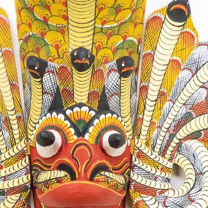 Authentic Naga Raksha Sri Lankan mask, hand-carved Kaduru wood with 7 cobra hoods, traditional red and yellow hand-painted details for BISO Heritage Collection.