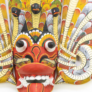 Authentic Naga Raksha Sri Lankan mask, hand-carved Kaduru wood with 7 cobra hoods, traditional red and yellow hand-painted details for BISO Heritage Collection.