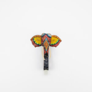 Front-facing hand-painted elephant wall sculpture, red and yellow floral ears, natural wood carving for BISO Heritage Collection.