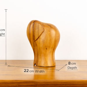 Modern minimalist hand-carved wooden elephant sculpture by traditional artists for BISO.