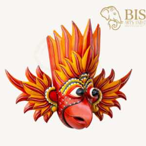 Angled view of hand-carved Gurulu Gini Raksha wooden mask