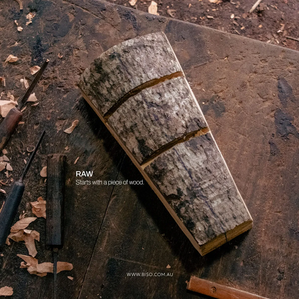 Raw block of wood with bark on a Sri Lankan carver's workbench – the first step of a genuine handmade wooden mask