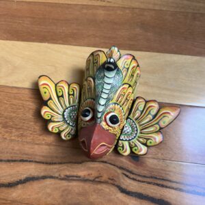 The Gurulu Gini Raksha is a traditional Sri Lankan handcrafted wooden mask