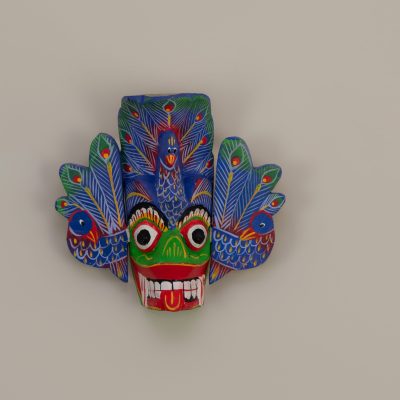Hand-painted 6-inch blue Sri Lankan Mayura Raksha peacock mask for wall decor.