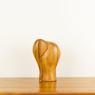 Modern minimalist hand-carved wooden elephant sculpture by traditional artists for BISO.