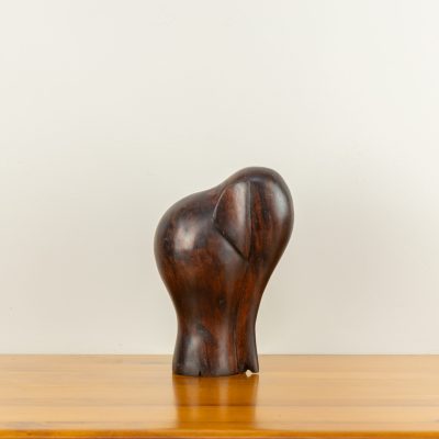 Modern minimalist elephant sculpture with a dark mahogany finish, hand-carved by traditional artists for BISO.