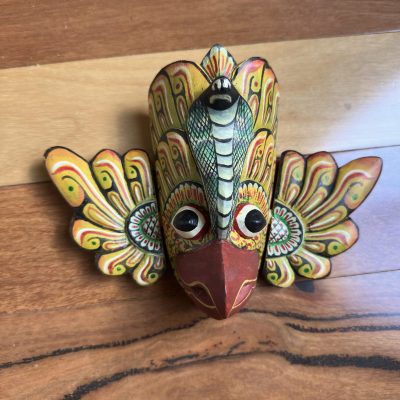 The Gurulu Gini Raksha is a traditional Sri Lankan handcrafted wooden mask